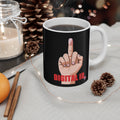 Black mug with a hand gesture design and 'DIGITAL ID' text, placed on a table with decorative items.