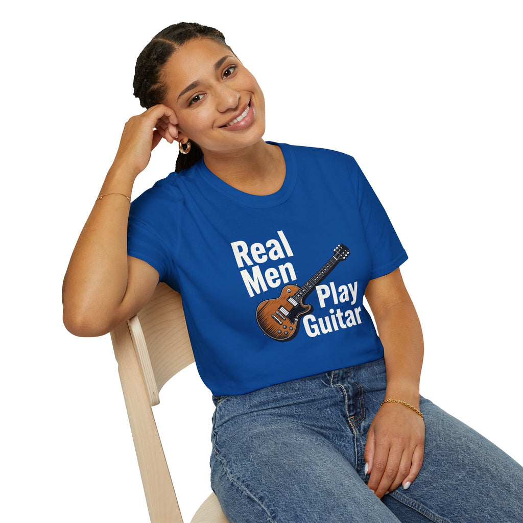 Person wearing a blue t-shirt with 'Real Men Play Guitar' text and guitar graphic.