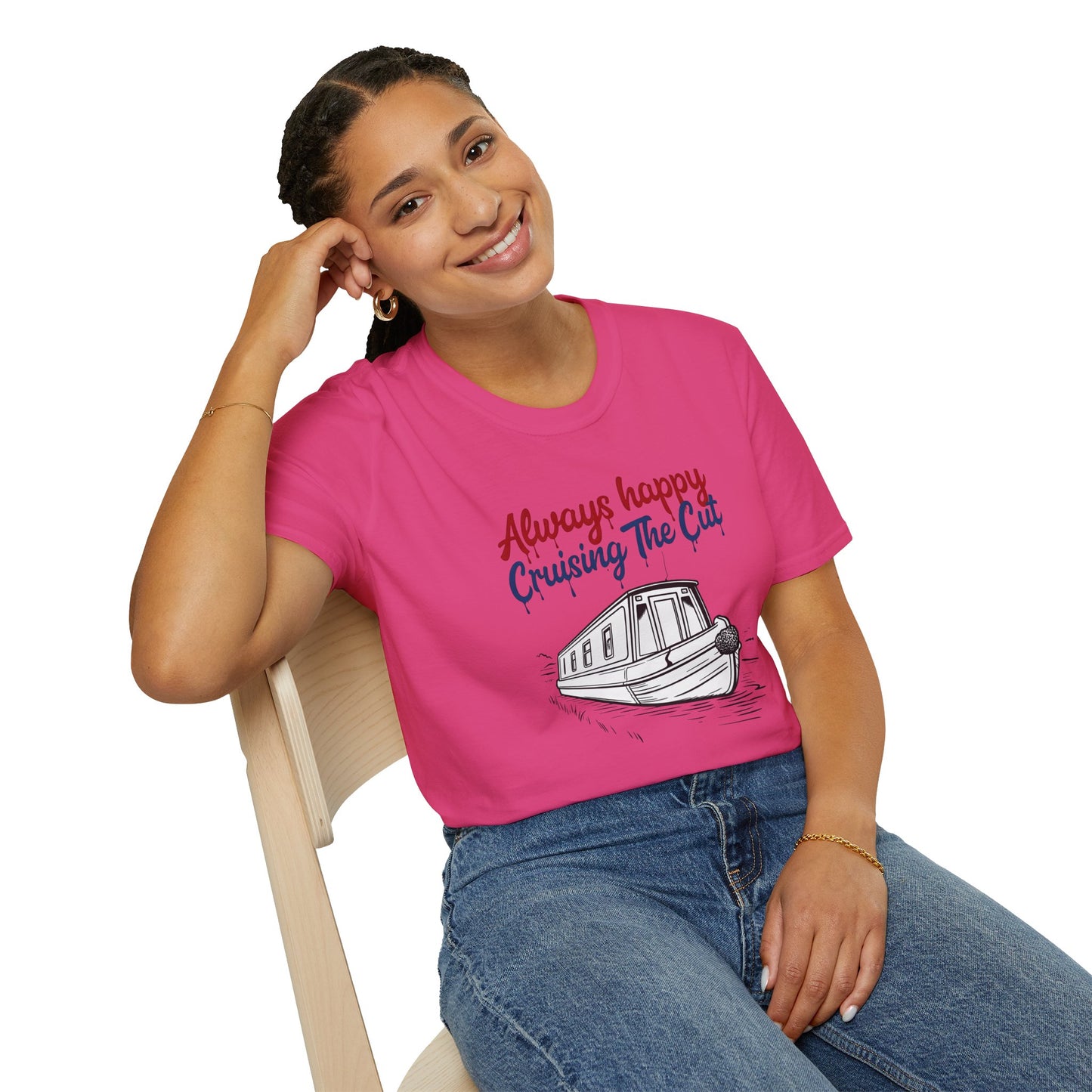 Person wearing a pink t-shirt with a boat graphic and text, sitting on a chair.