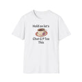 White t-shirt with a graphic of a teacup and saucer and text "HOLD ON LET'S G P TEA THIS" on a white background