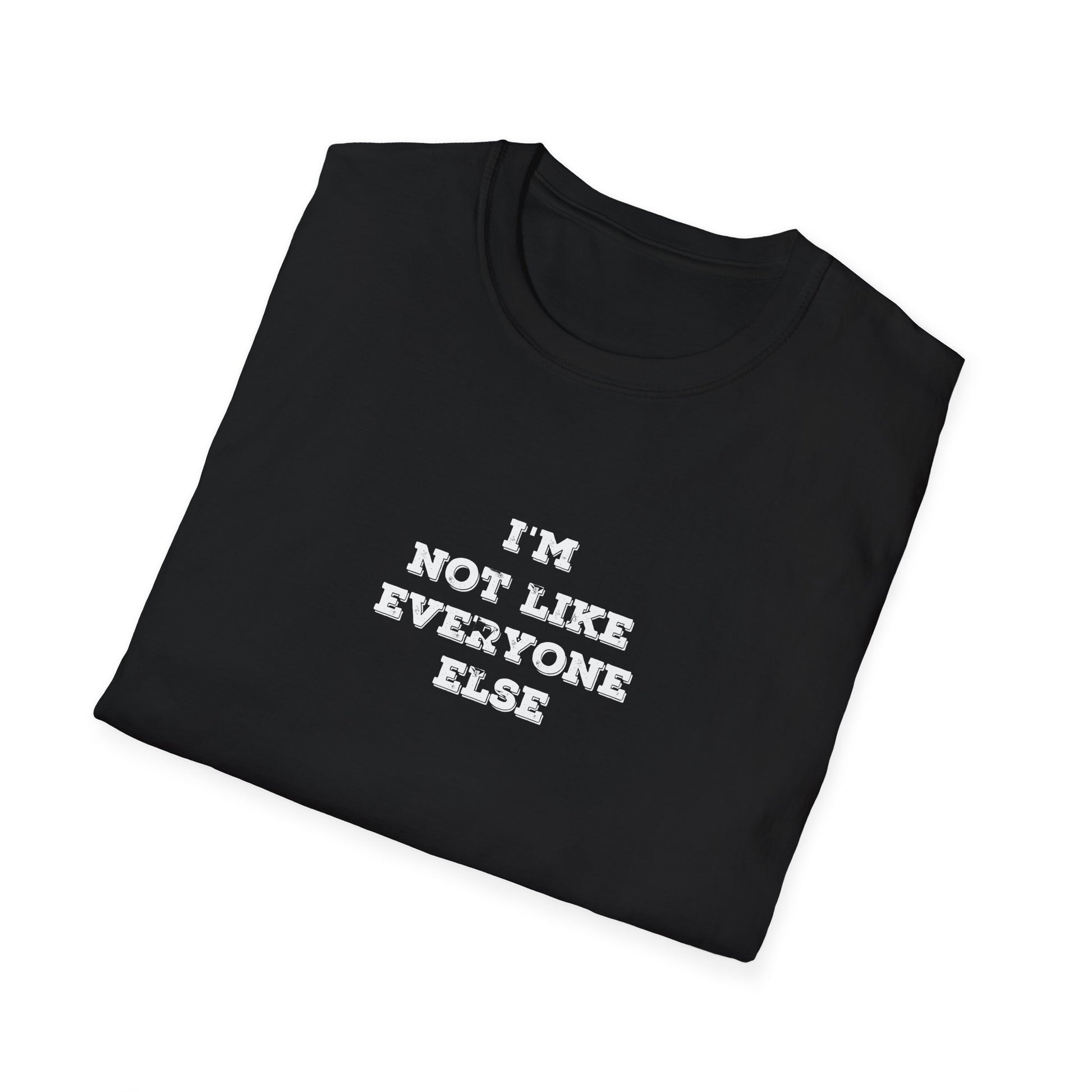 Folded Black t-shirt with 'I'm not like everyone else' text on a white background