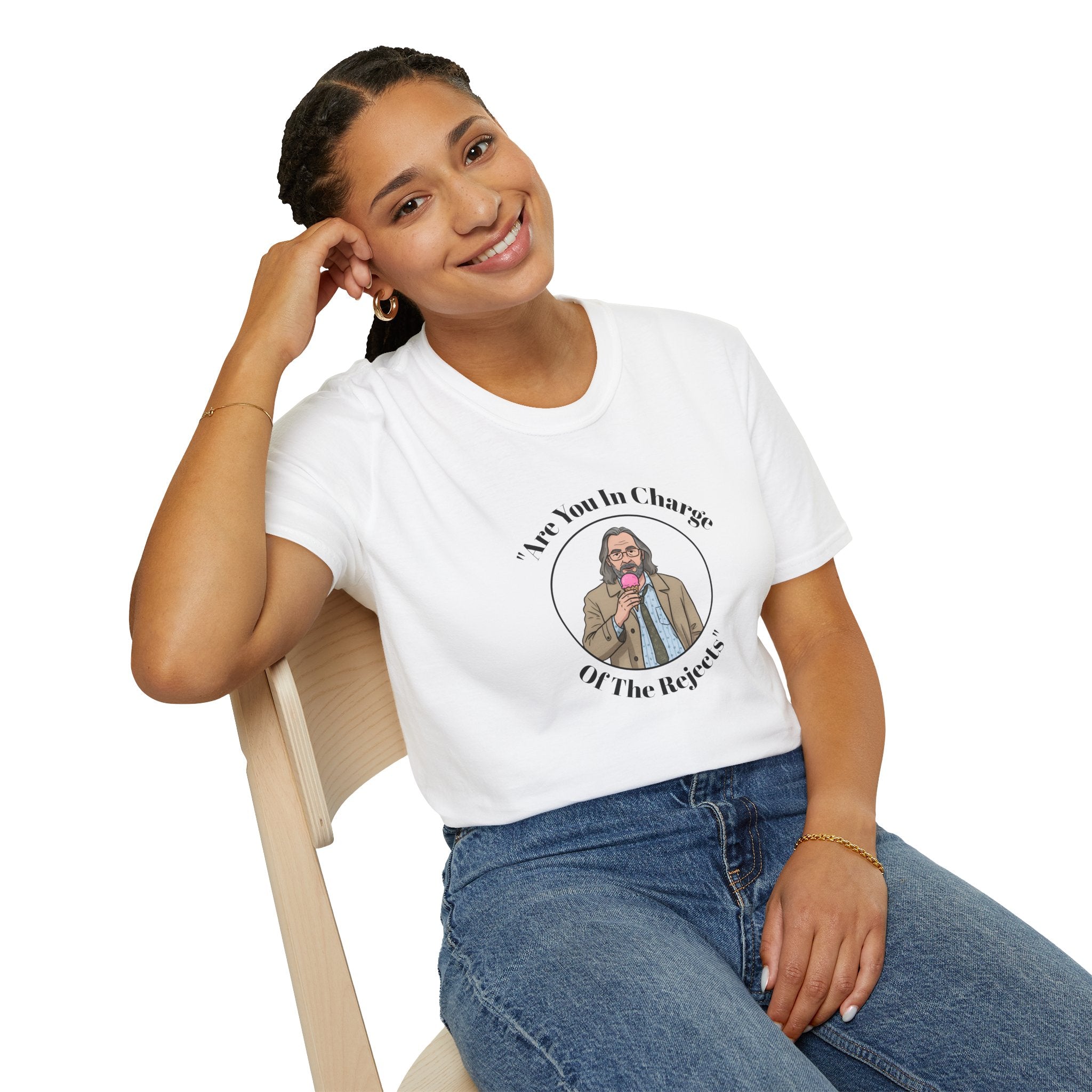 Person wearing a white t-shirt with a Jackson lamb graphic and text, sitting on a chair against a white background