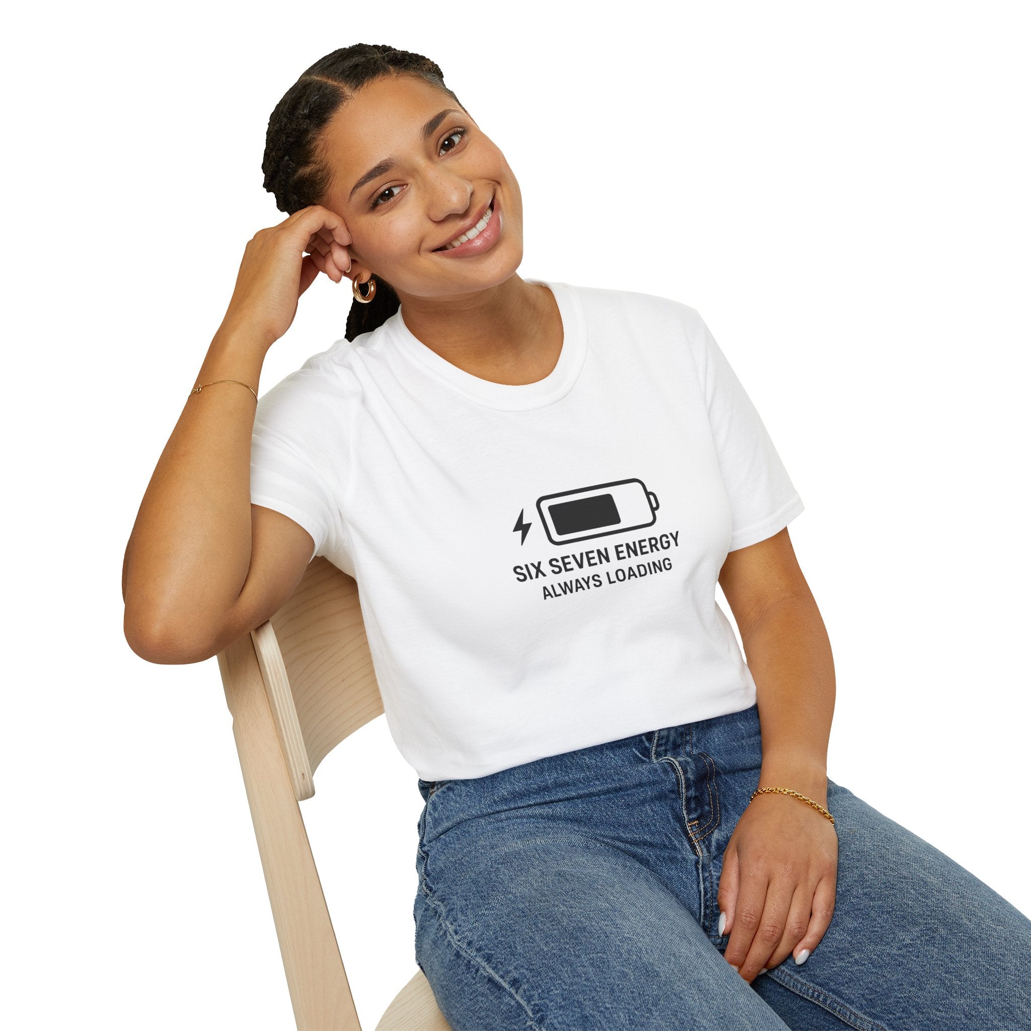 Person wearing a white t-shirt with a graphic six seven meme and text, sitting on a chair against a white background