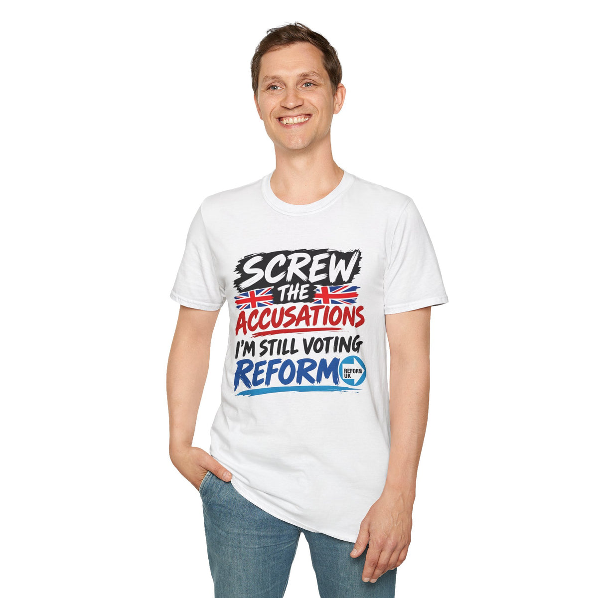 A man wearing a white graphic t-shirt with the text 'SCREW THE ACCUSATIONS I'M STILL VOTING REFORM' in black, red, and blue, paired with blue jeans, against a plain white background.