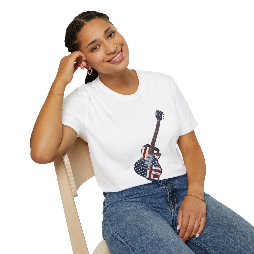 Person wearing a white t-shirt with a guitar design, sitting on a chair against a white background