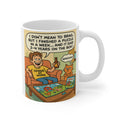 Mug with a cartoon design of a man and cat playing with a  jigsaw puzzle, featuring humorous text.
