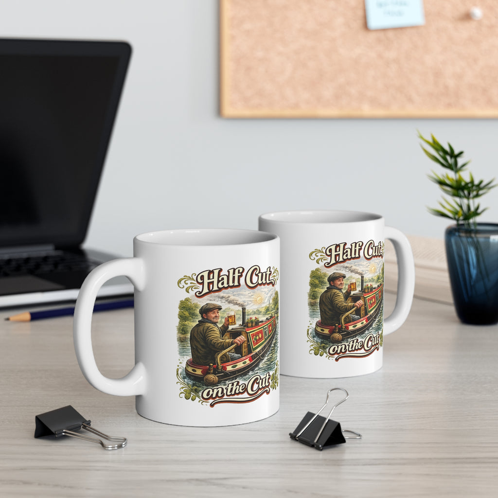 Two mugs with vintage-style graphics on a desk with office items.