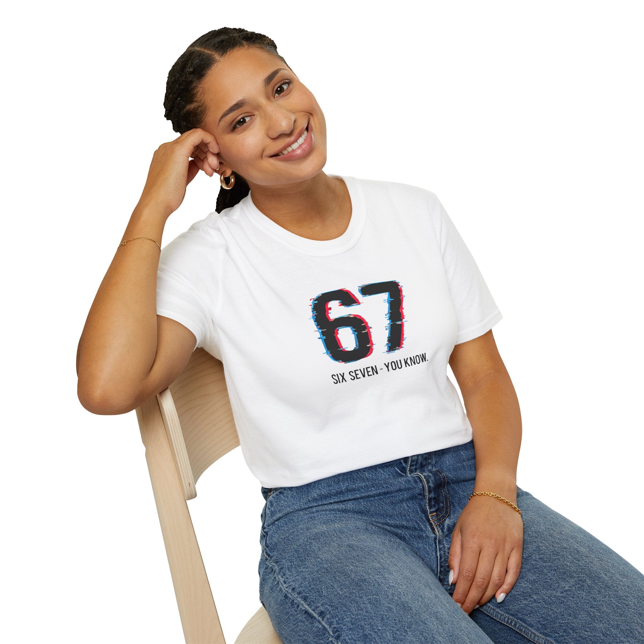 Woman wearing a white t-shirt with '67' design, sitting on a chair against a white background