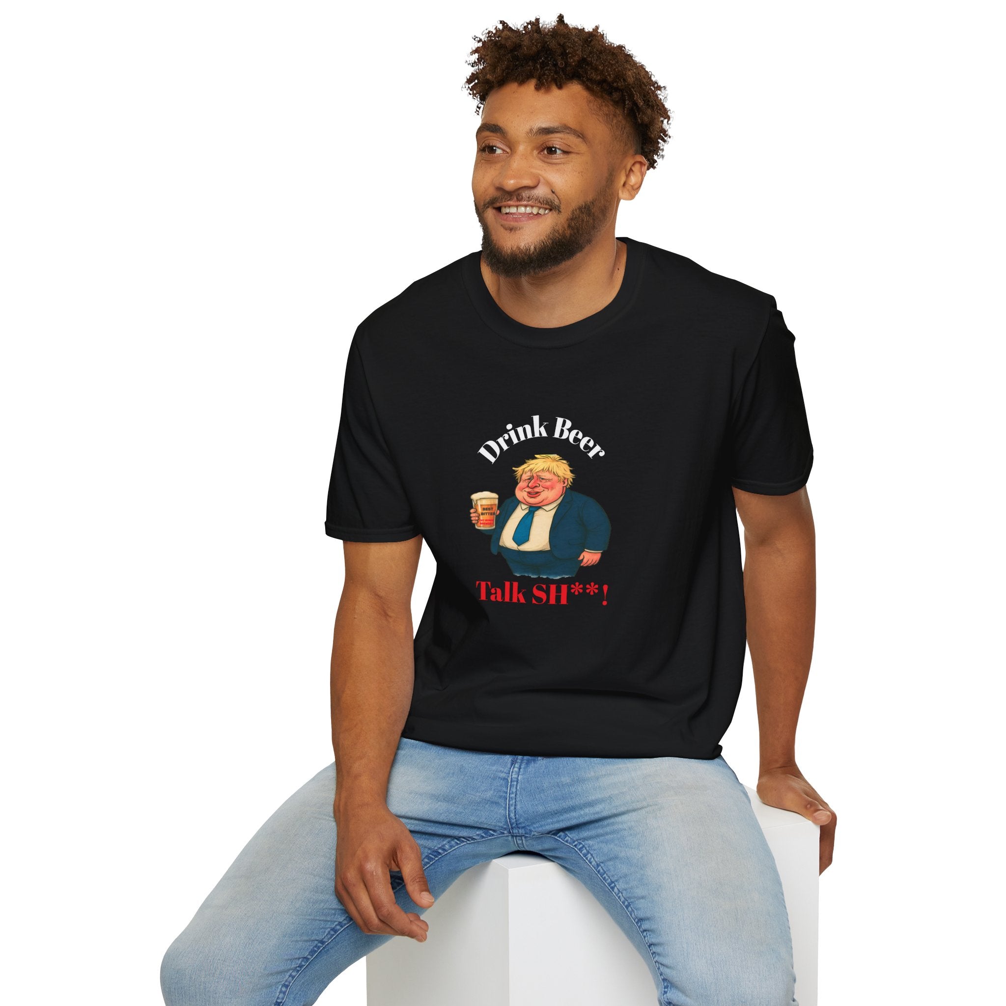 Man sitting wearing a black t-shirt with graphic of Fat Boris holding a beer and text drink beer talk sh**!  on a white background