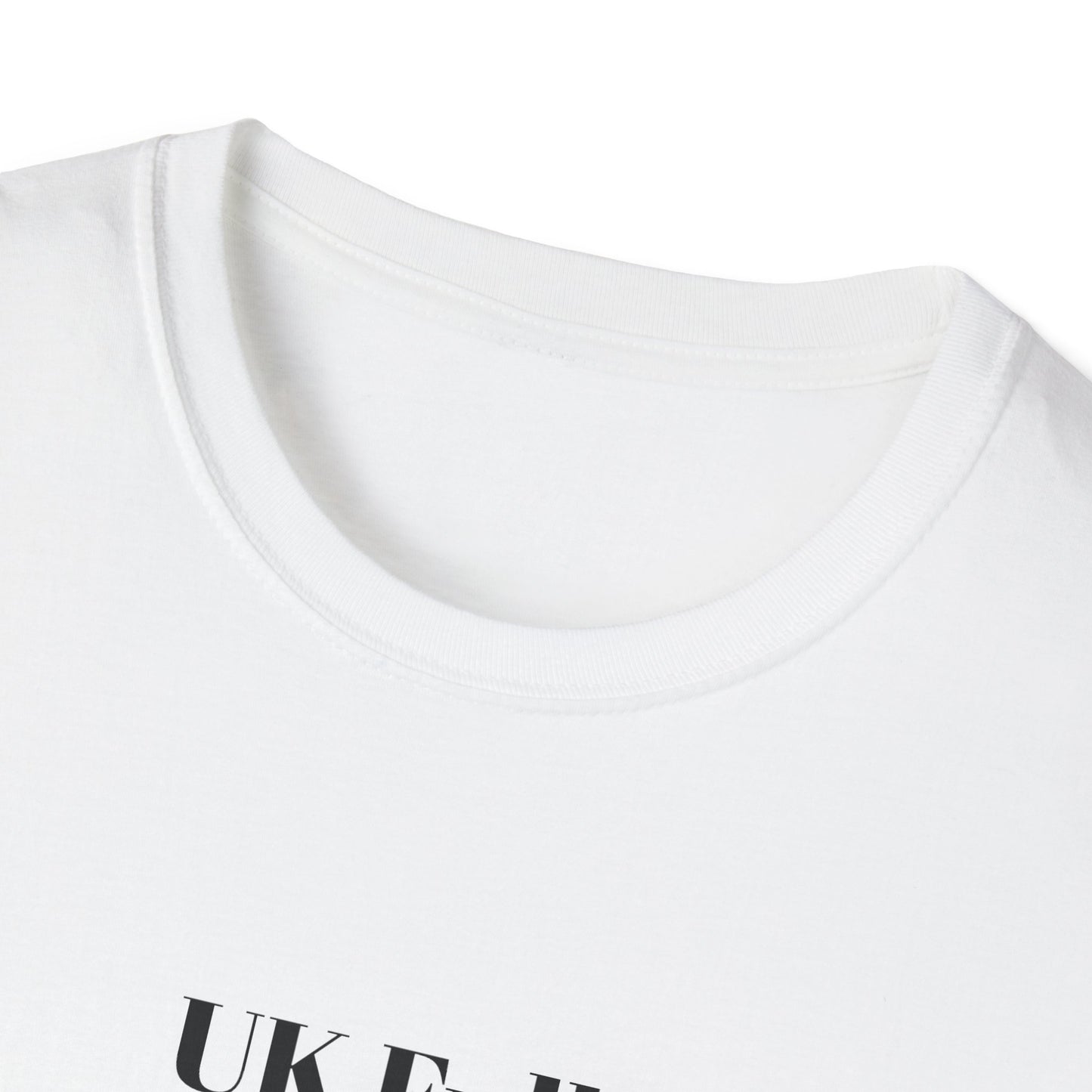 Close-up of a white t-shirt with 'UK Full standing room only' text on a white background
