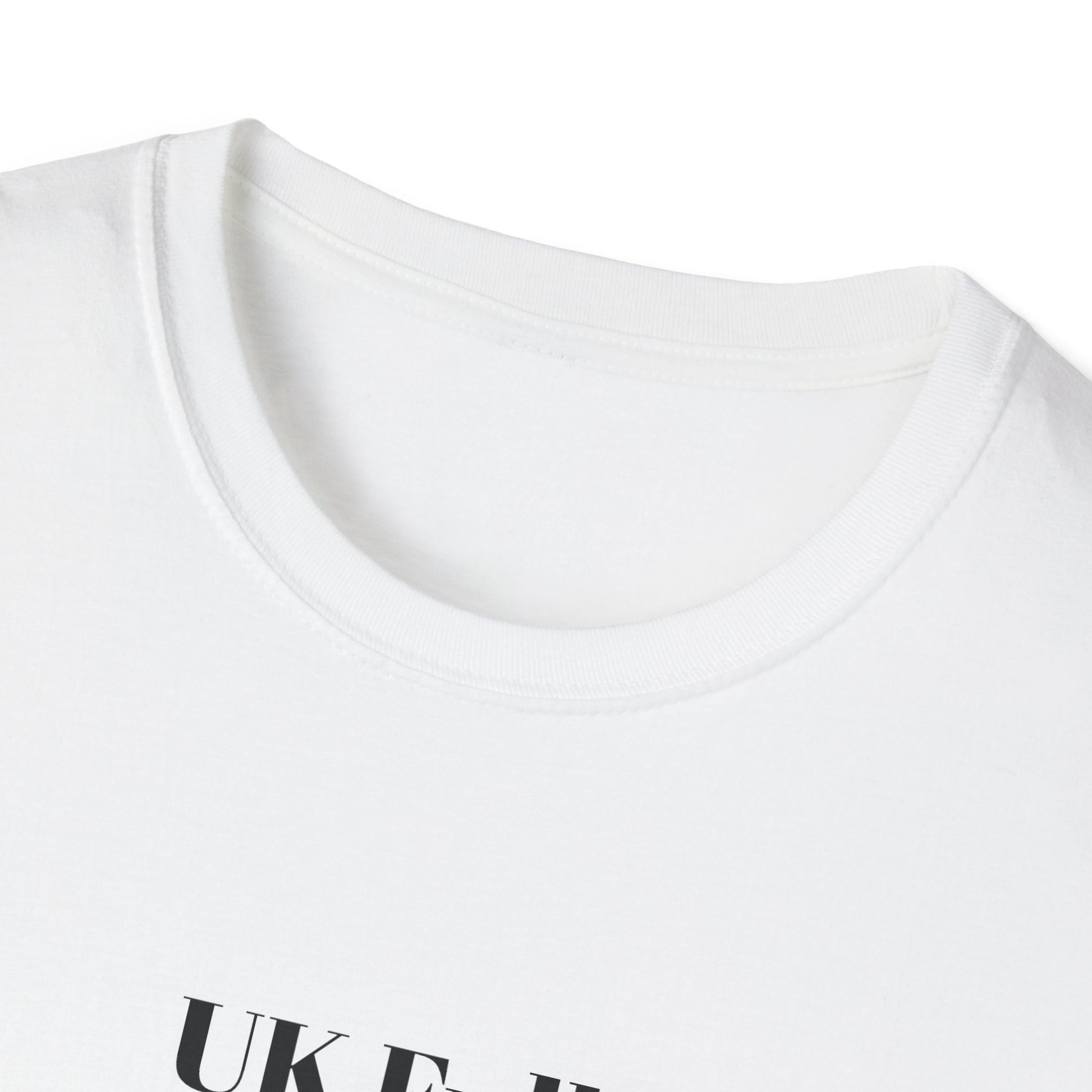 Close-up of a white t-shirt with 'UK Full standing room only' text on a white background
