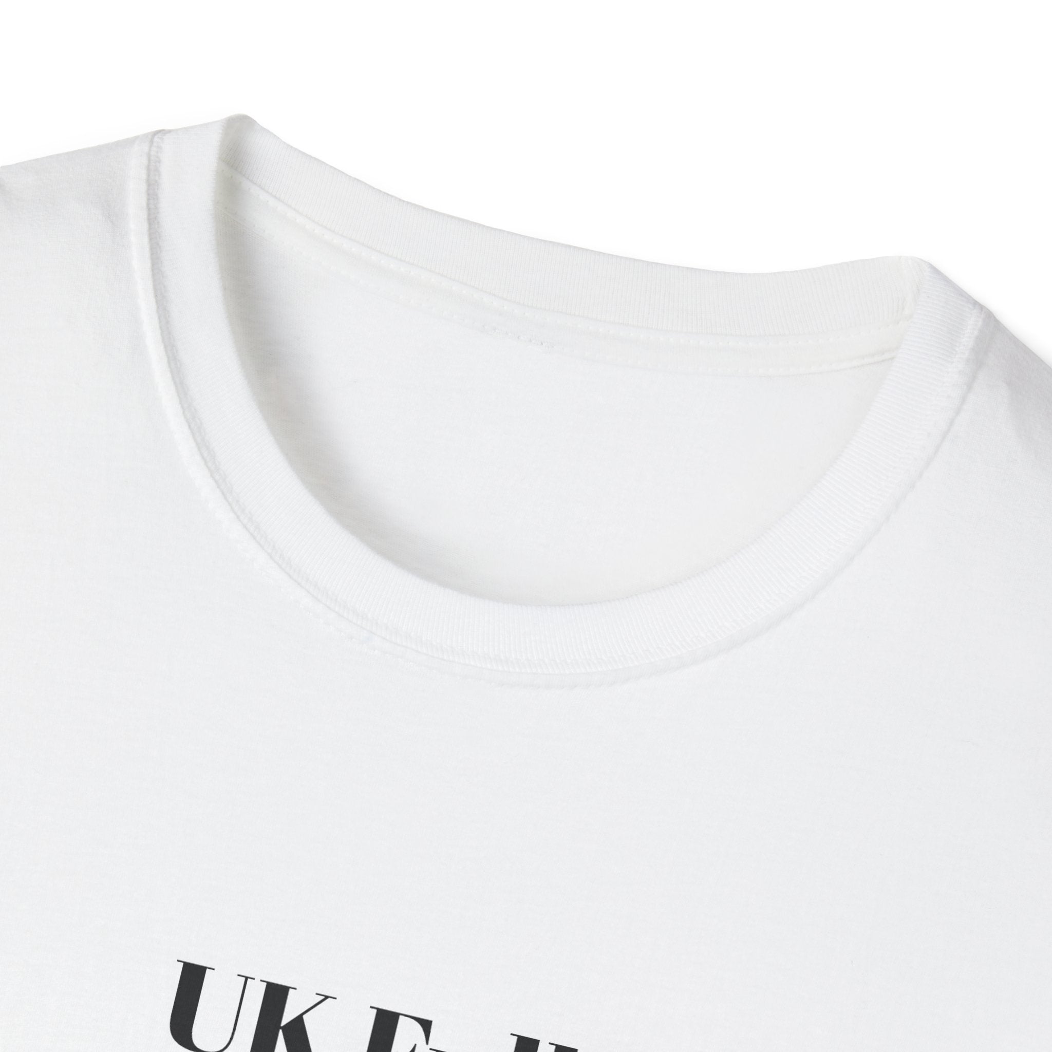 Close-up of a white t-shirt with 'UK Full standing room only' text on a white background