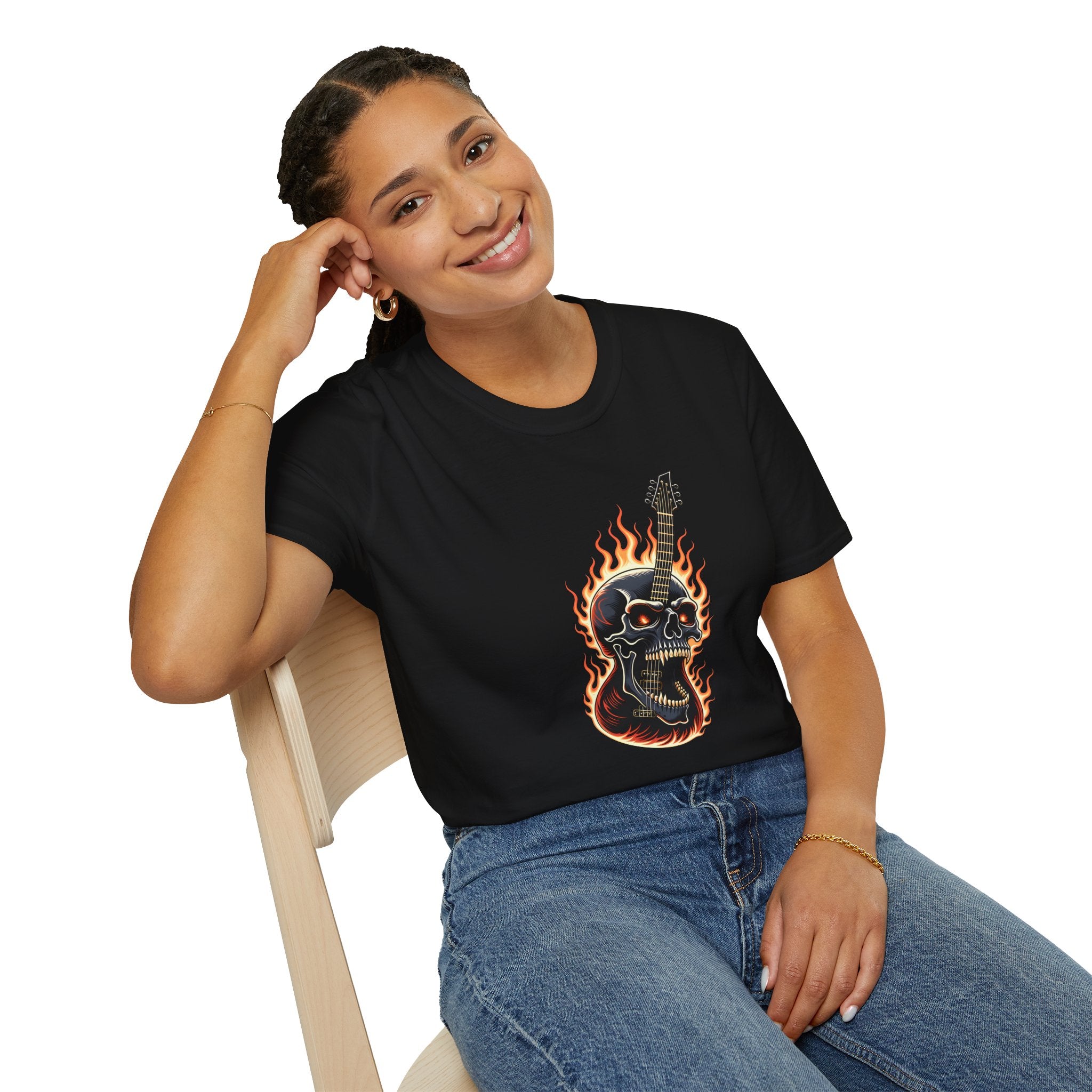 Person wearing a black t-shirt with a guitar and flaming skull design on a white background
