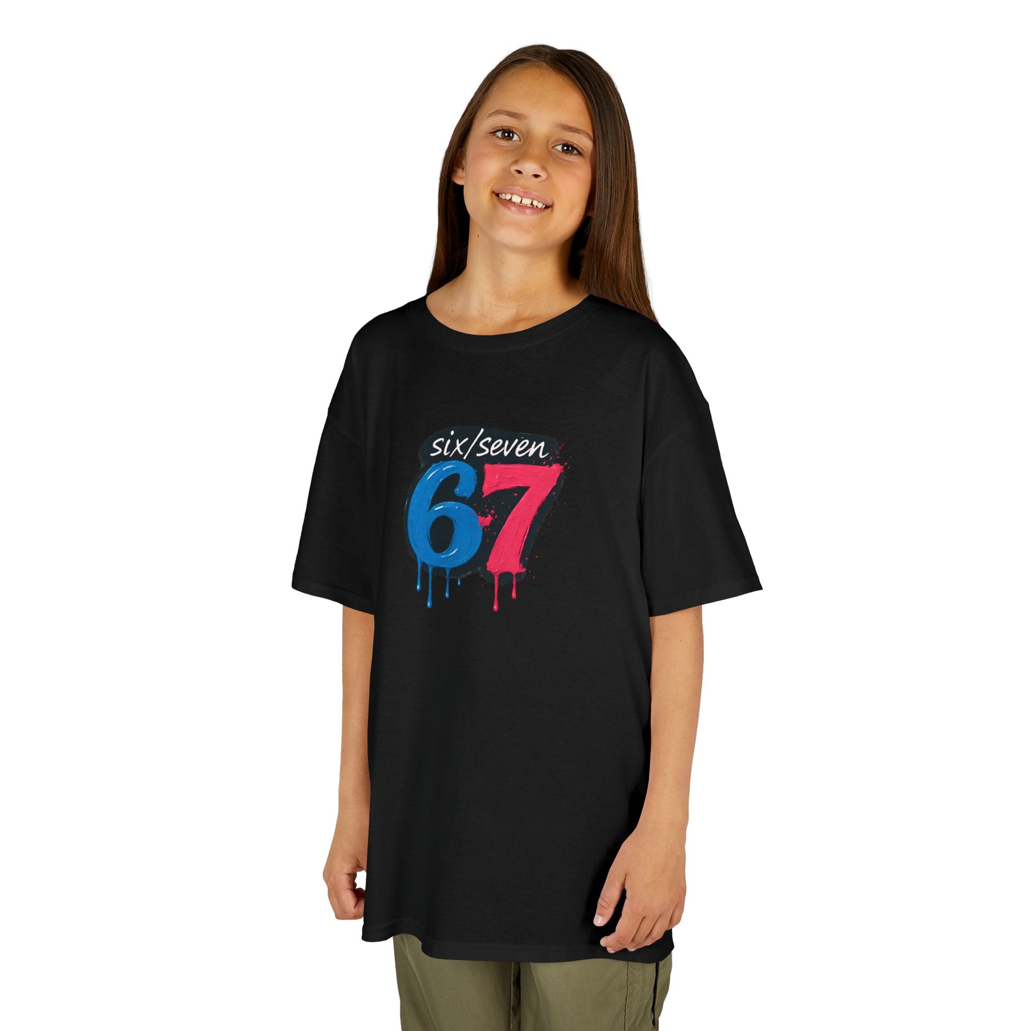 Child wearing a black t-shirt with colourful  oil drip paint six seven design on a white background