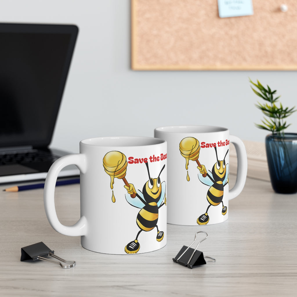 Two mugs with bee designs and 'Save the Bees!' text on a desk.