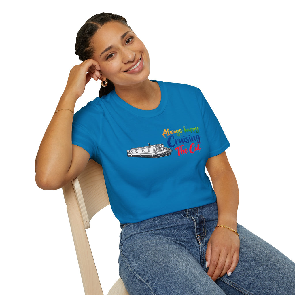 Woman wearing a blue t-shirt with colorful text and graphic, sitting on a chair.