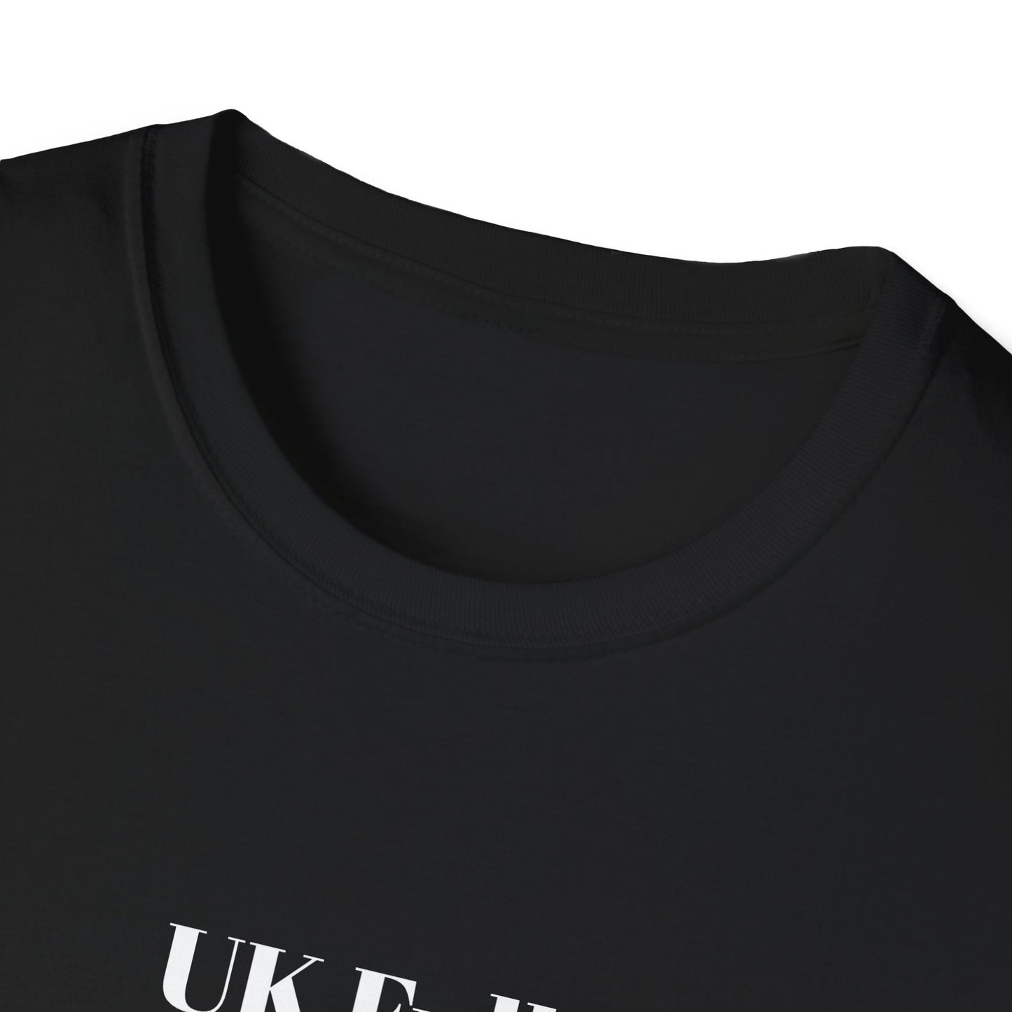 Close-up of a black t-shirt with text on a white background