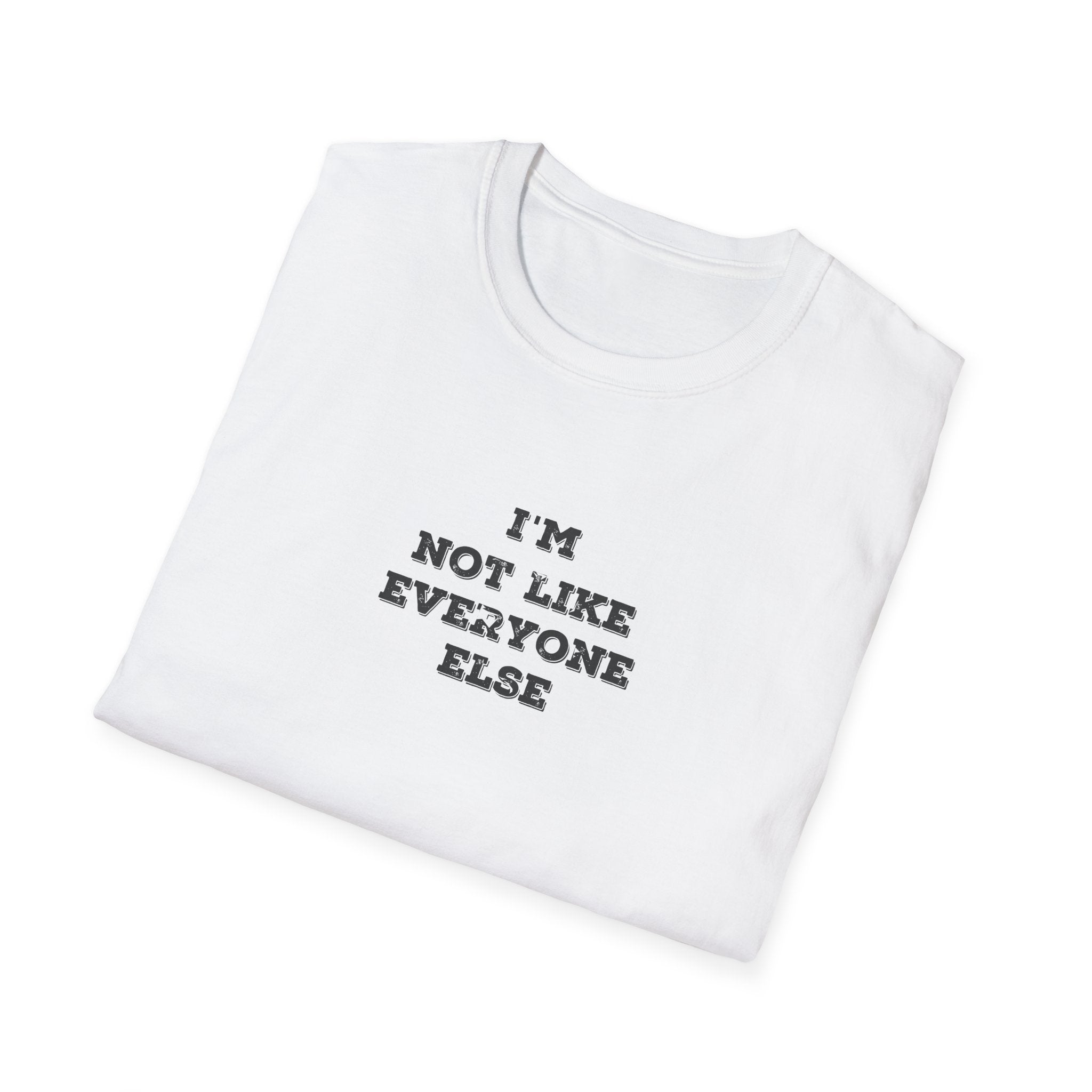 Folded White t-shirt with 'I'm Not Like Everyone Else' text on a white background
