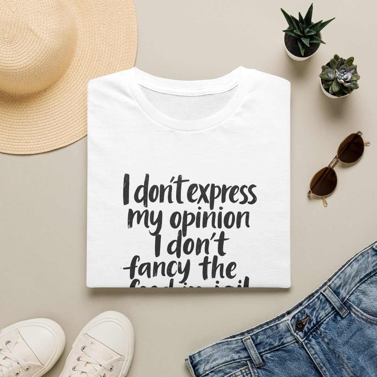 White/black Gildan Softstyle t-shirt with distressed brush-stroke text “I don’t express my opinion I don’t fancy the food in jail” and small Union Jack – UK free speech satire referencing Allison Pearson