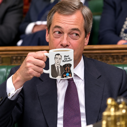 Nigel Farage n a dark suit and purple tie holds a white ceramic mug with a cartoon illustration of a man and a Rottweiler dog and the text 'Meet Zia my Rottweiler!' in a formal indoor setting.