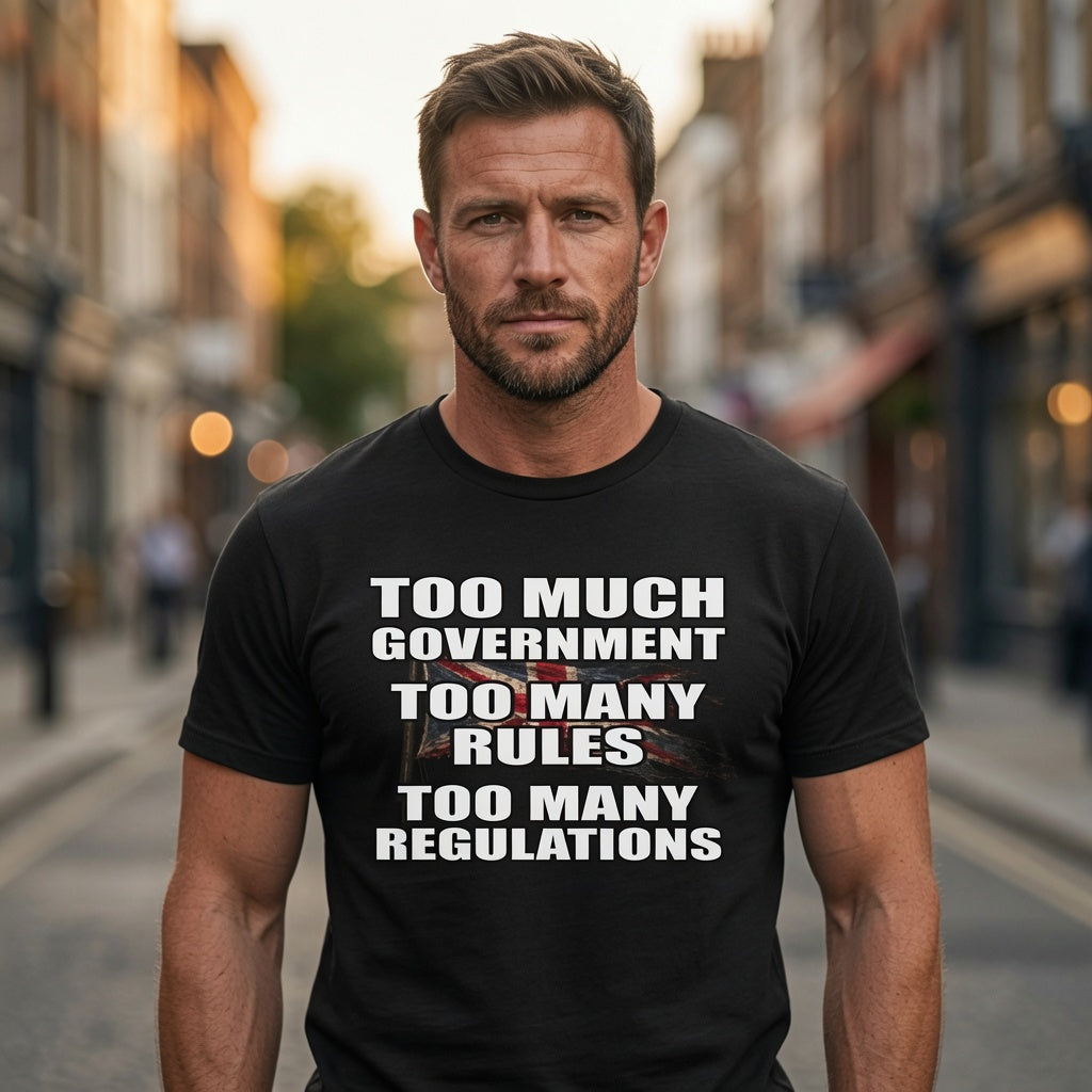 Man wearing a black t-shirt with a government  protest message on a city street.