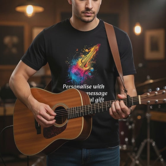  VIDEO OF   Person playing an acoustic guitar wearing a black t-shirt with a colourful graphic GUITAR DESIGN and PERSONALISED text.